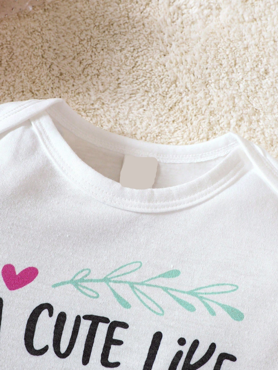 This trendy and comfy Adorable Baby Girl Slogan Graphic Bodysuit is perfect for your little one. Made with soft and high-quality materials, it features a cute and stylish graphic slogan that will make your baby stand out. Keep your baby comfortable and fashionable with this adorable bodysuit.