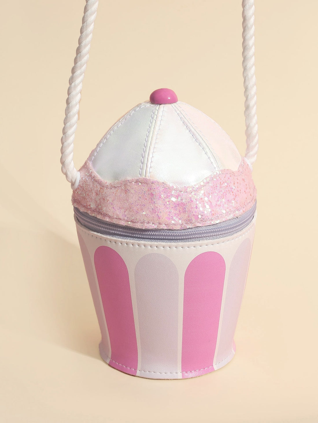 This charming Delightful Cupcake Crossbody Bag is the perfect accessory for any girl. Its sweet cupcake design and crossbody style make it both stylish and convenient. Crafted with high-quality materials, this bag is not only cute but also durable. A must-have for any girl's wardrobe.