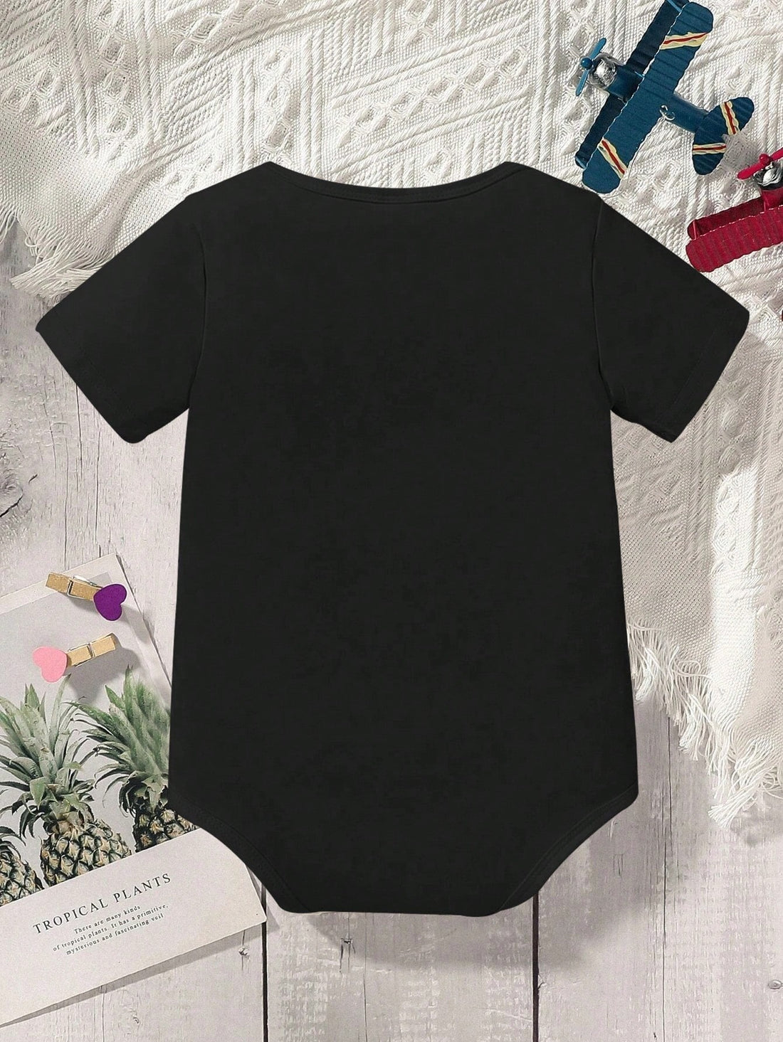 Introduce your little one to the world in style with our Adorable Baby Boy's Bodysuit. Made with soft, breathable fabric, this short-sleeved bodysuit features a trendy slogan and eye-catching triangle print. Perfect for playdates or everyday wear, it's the perfect addition to any baby boy's wardrobe.