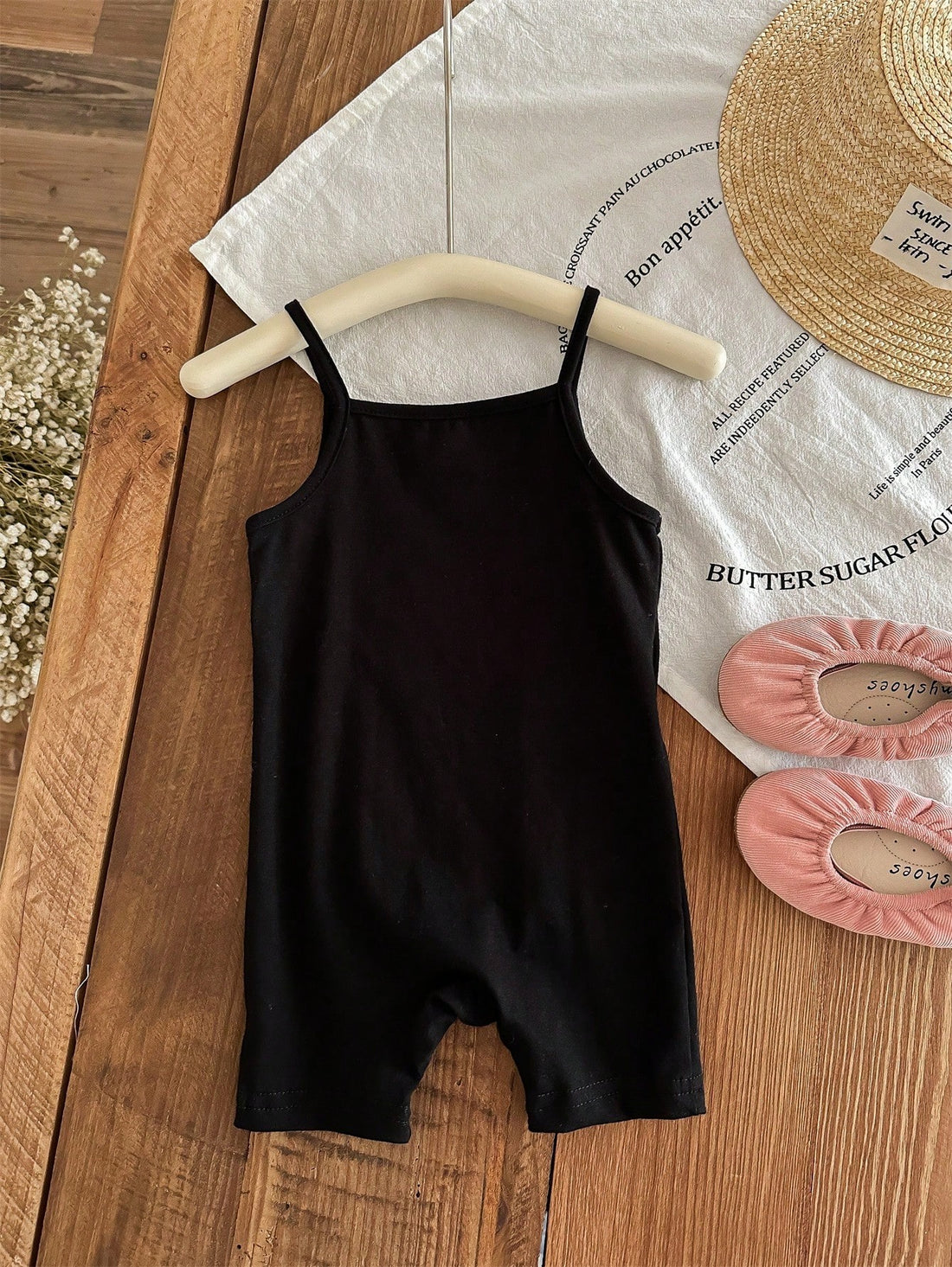 Introduce your baby girl to summer style with our Adorable in Letters tank top romper set. Made with lightweight materials, this set is perfect for warm weather. Featuring a charming "Adorable" letter design, it's sure to make your little one stand out.