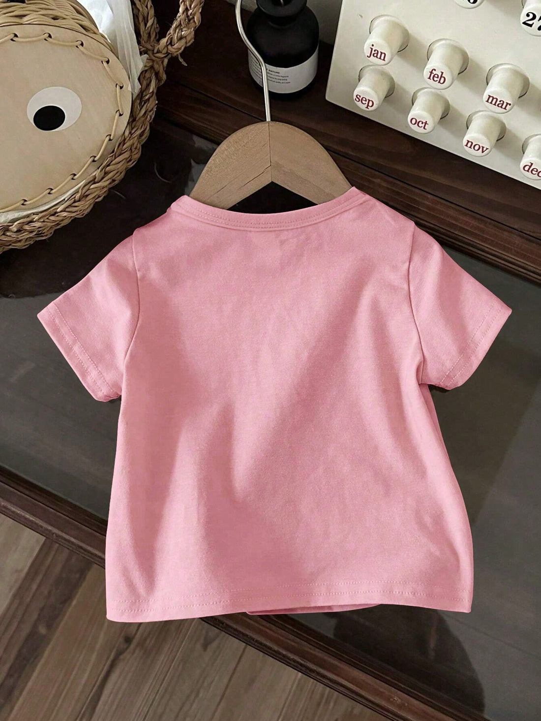 This adorable strawberry print top is perfect for your baby girl's spring and summer wardrobe. Made with a soft and comfortable fabric, this casual top will keep your little one cool and stylish. Its cute strawberry design adds a touch of sweetness to any outfit. A must-have for any fashion-forward baby girl.