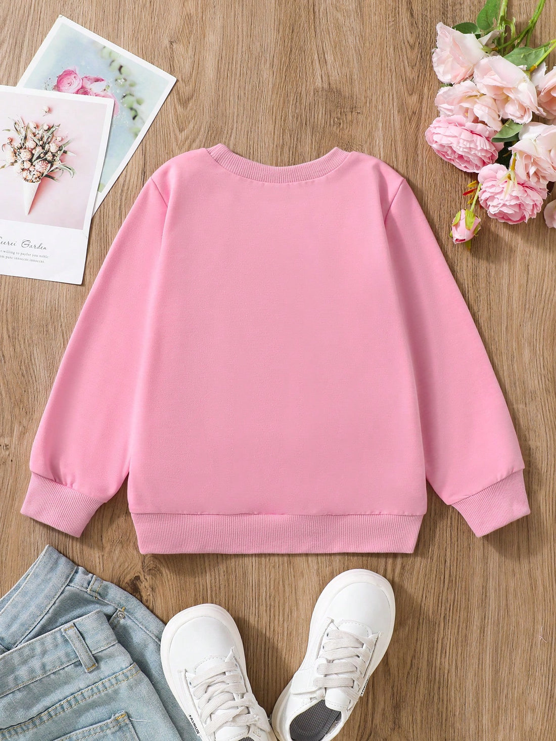 Elevate your young girl's wardrobe with our Charming Floral & Letter Print Pullover Sweatshirt. The charming floral and letter prints add a touch of style while the cozy pullover design keeps her warm and comfortable. Perfect for any occasion, this sweatshirt is a must-have for any young fashionista.