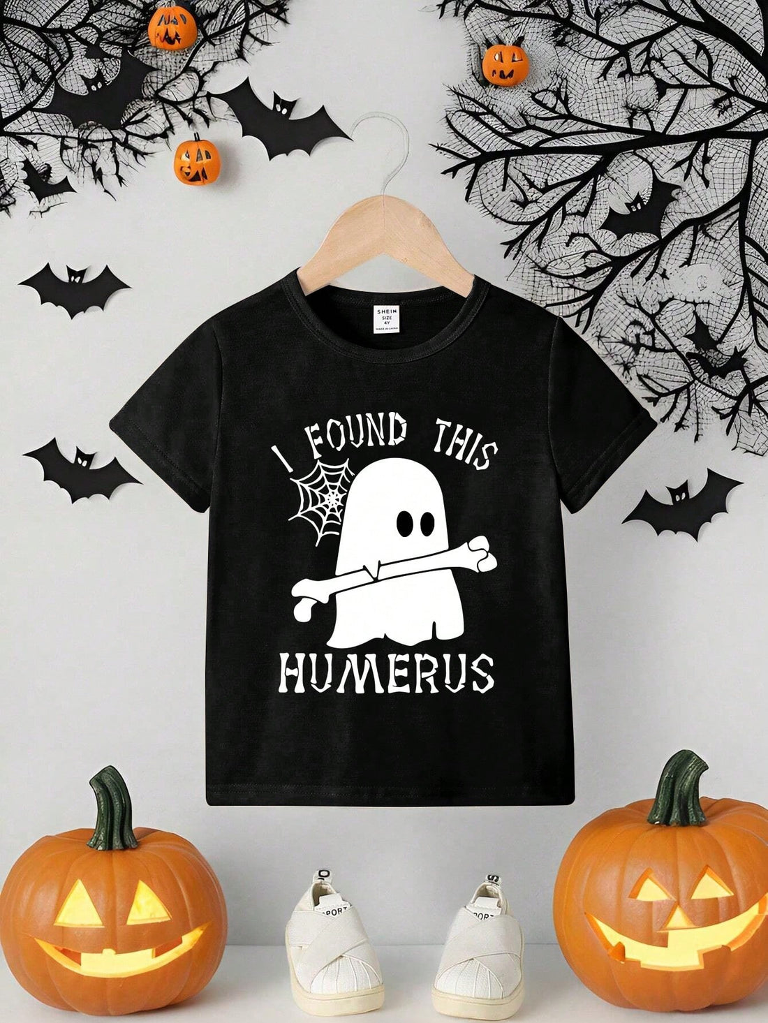 This Spooky Style Halloween Ghost Print Knitted T-Shirt is perfect for young boys who want to rock the holiday in style. Made with a high-quality knit material, it offers both comfort and durability. The ghost print adds a fun and festive touch, making it a must-have for any Halloween celebration.