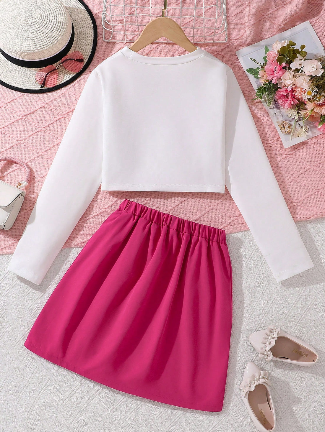 This stylish set includes a letter print top and utility skirt, perfect for fashion-forward big girls. The top features a chic design and the skirt offers practicality. Stay on-trend while staying comfortable and confident!