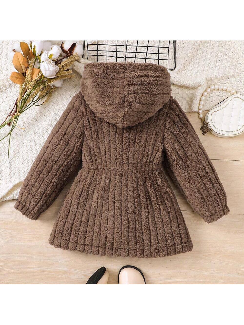 This Chic Comfort long coat for girls is designed with a soft faux fur hood, providing warmth and style for the autumn/winter season. The solid color adds a touch of elegance to any outfit. Made with high-quality materials, this coat offers both comfort and durability.