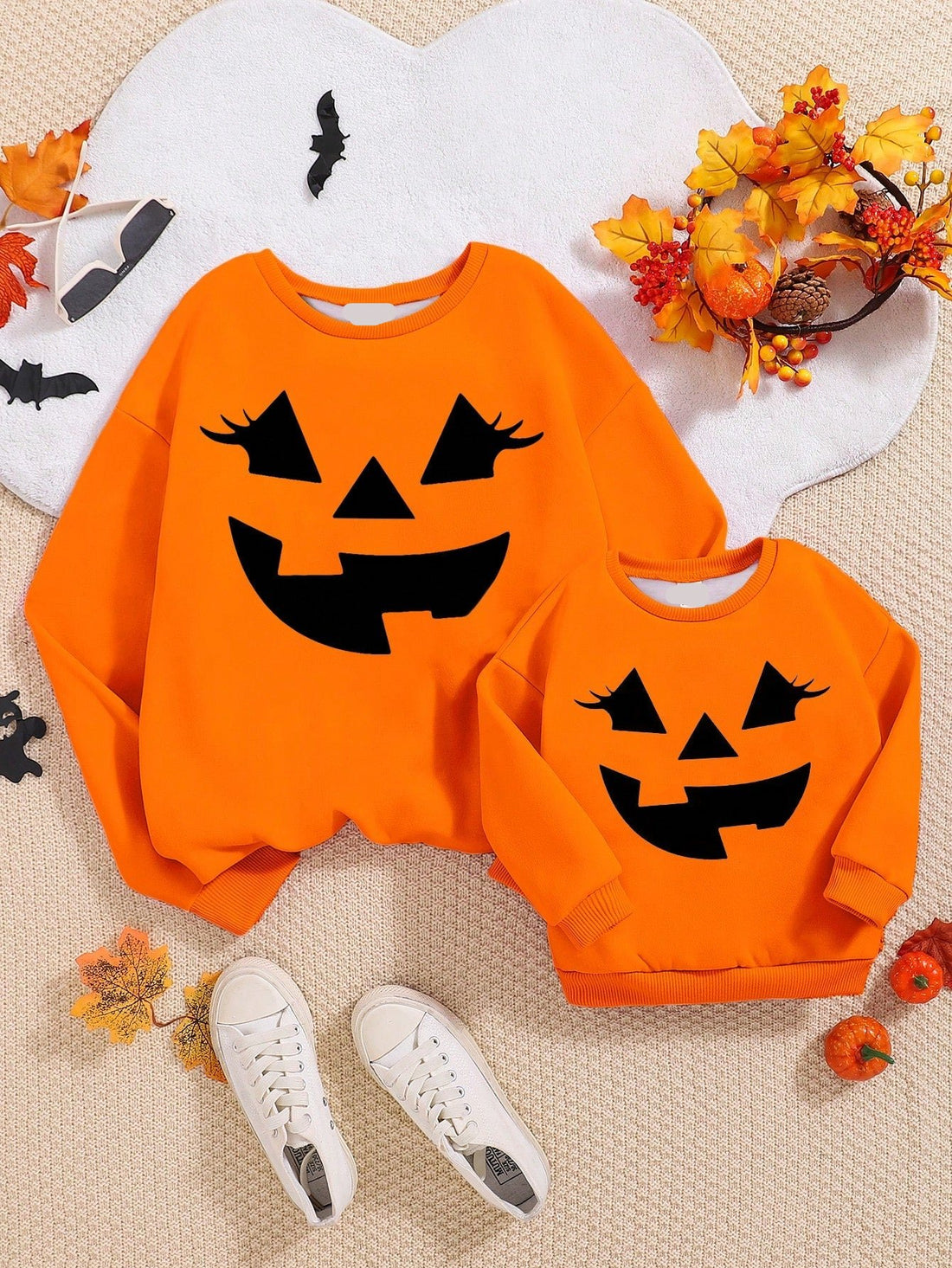 This Halloween, treat your little girl to the cutest and coziest sweatshirt she'll love to wear all season long! Our adorable Halloween-themed crewneck sweatshirt features a fun print and cozy style, perfect for staying warm and stylish. Crafted from high-quality materials, she'll adore this must-have for chilly fall days.