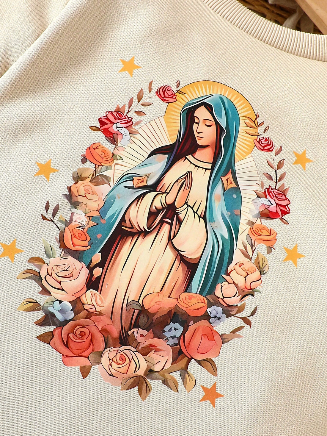 This cozy sweatshirt for young girls features a beautiful Virgin Mary print, making it a perfect piece for the autumn and winter seasons. Keep your little one warm and stylish while paying homage to religious iconography.