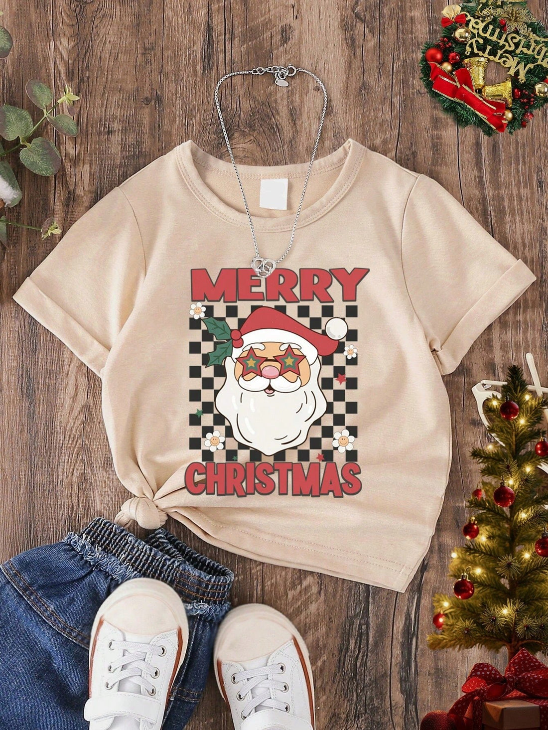 Get into the holiday spirit with our Checkerboard Santa Claus Letter Print Toddler T-Shirt! Perfect for a Christmas party, this shirt features a festive design that will make your little one stand out. Made with high-quality materials, this shirt is comfortable and durable. Spread joy and cheer with this stylish and fun shirt.