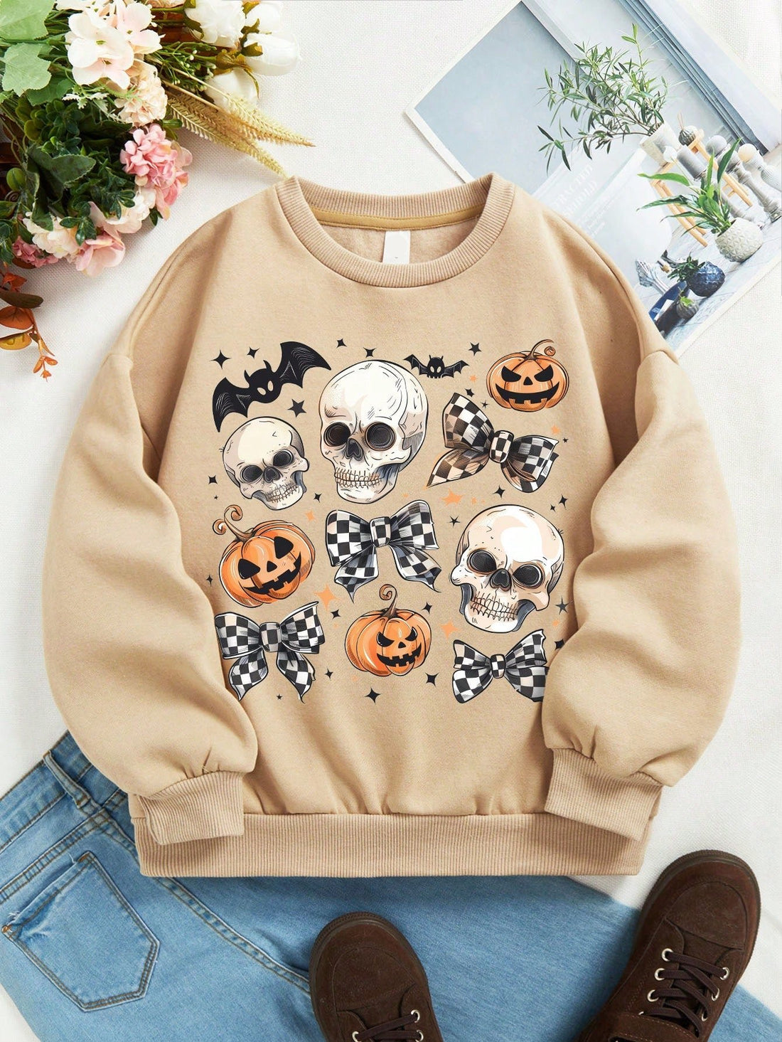 This pumpkin skeleton print cozy pullover is perfect for young girls to stay stylish and warm during fall and winter. Made from high-quality materials, it is great for casual daily wear. Its playful design adds a fun touch to any outfit. A must-have for any fashion-forward young girl.