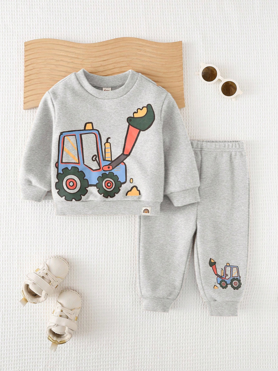 Get your little one ready for a comfy stroll with the Adorable Cozy Pixie 2-Piece Baby Boy Stroller Set! This set includes a knitted sweatshirt with a cute cartoon design and cuffed pants for extra warmth. Perfect for keeping your baby cozy and stylish on the go.