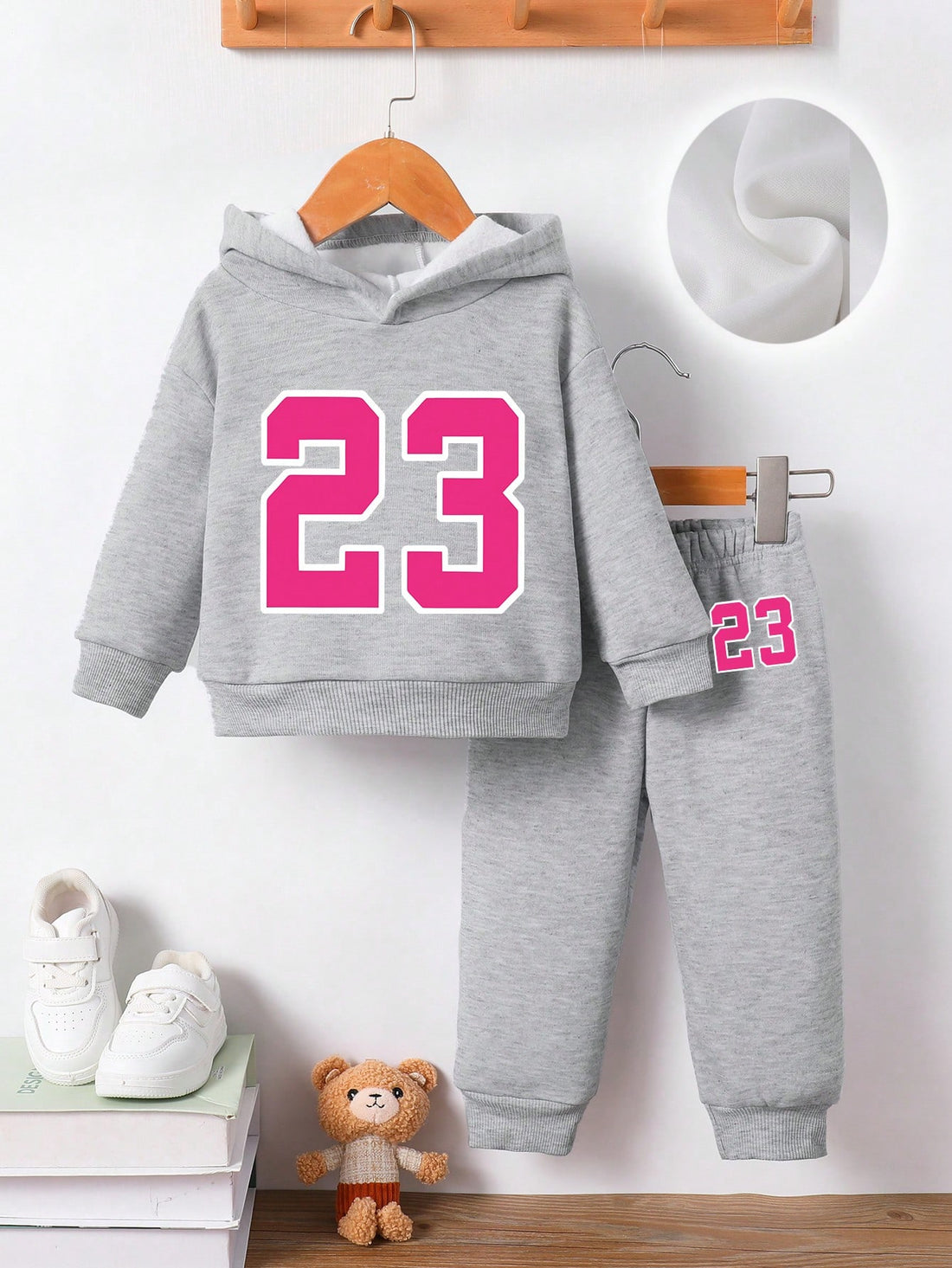 This 2-piece set is perfect for your little girl's autumn and winter wardrobe. The adorable hoodies and pants feature a fun numeral print that adds a touch of cuteness to any outfit. Keep your baby cozy and stylish during the colder seasons.