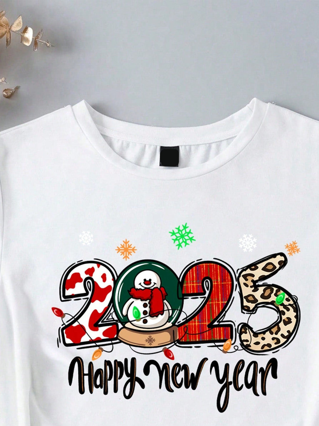 Get ready to stand out this holiday season with our Christmas & New Year 2025 Vibe Minimalist Tee for Teen Girls! This casual short sleeve shirt features a unique design that will set you apart from the crowd. Embrace your bold and adventurous side with this must-have shirt!