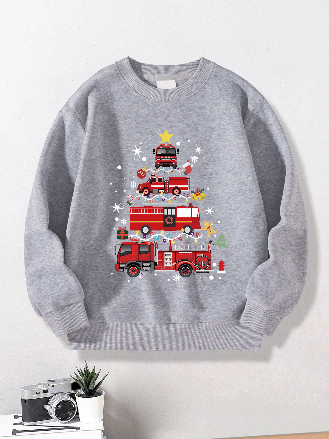 Get ready to rock this holiday season with our Festive Firetruck Graphic Sweatshirt for Young Boys! Featuring a bold firetruck graphic, this Christmas edition sweatshirt is perfect for little adventurers. Stay warm and stylish while spreading holiday cheer. Available now in limited quantities. Order yours today!