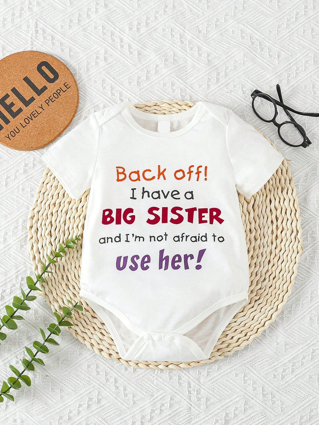 This Baby Girls' Bodysuit features a cute and trendy slogan print, making it the perfect addition to your little one's wardrobe. Made with soft and high-quality fabric, it provides comfort and style for your baby. An essential piece for any stylish baby girl.